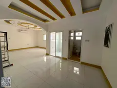 Two-bedroom apartment with a living room for annual rent in Al Jurf 2, first occupancy