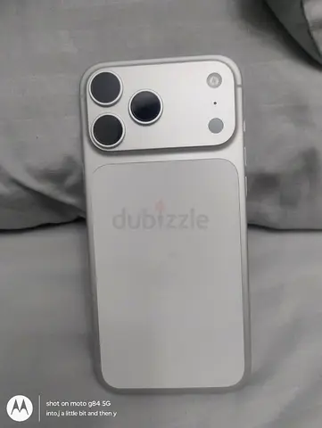 iPhone-style 3-camera silver smartphone (used) — good condition