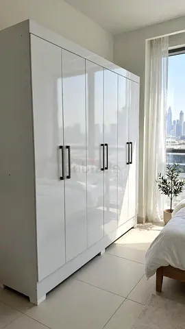White glossy 6-door wardrobe with metal handles - good condition