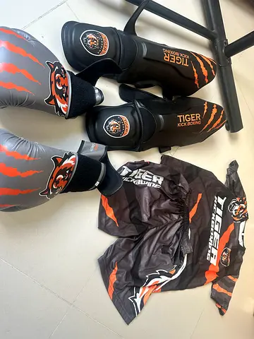 Tiger branded full Muay Thai/Kickboxing gear set — shin guards, gloves, shorts, top (used)