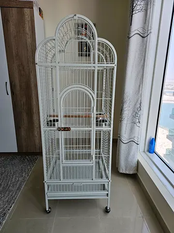 Large white metal bird cage with stand and wheels - good condition