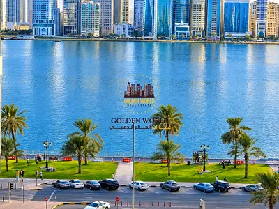 2BR apartment in Al Majaz 1, Sharjah, for annual rent at AED 35,000. Sea view, central AC, clean finish, near services, 24/7 security.