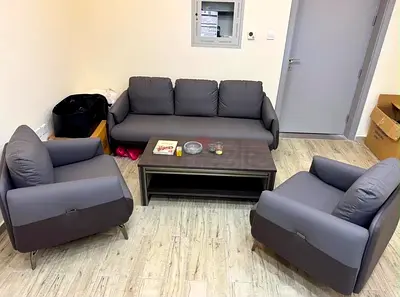 Grey 3-seater sofa with 2 matching armchairs and coffee table - good condition