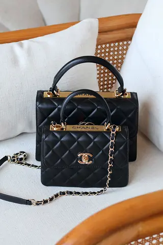 Black quilted top-handle Chanel-style bag with chain strap