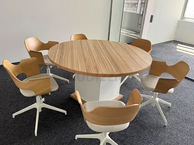 Round wooden meeting table with 6 swivel chairs - modern office set