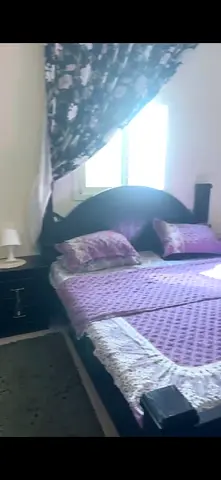 Queen size wooden bed with matching nightstand - good condition