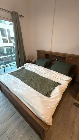 Solid wood king bed frame with headboard - excellent condition (without sheets)