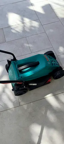 Used Bosch Electric Lawn Mower - Compact, Good Condition