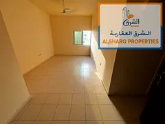 Spacious 1-bedroom apartment with a living room and central air conditioning; located in Al Nuaimiya