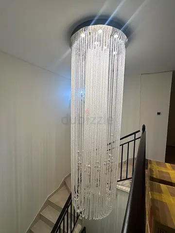 Long crystal-style ceiling chandelier, large cascading design