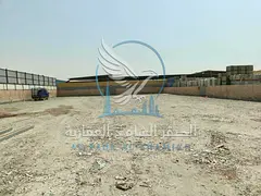 20,000 Sq. Ft. Yard for Rent in Al Sajaa | Offices & Bathrooms | Spacious Area | Prime Industrial Lo