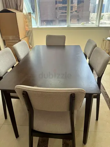 Solid wood dining table with 6 upholstered chairs - good condition