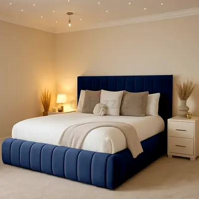 King-size navy upholstered bed with padded headboard