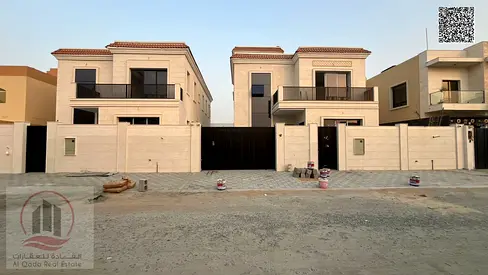 Villa for sale in Al Muwaihat 3, Ajman. Features 5 master bedrooms, a majlis, a living room, and a maid's room. Freehold ownership available for all n