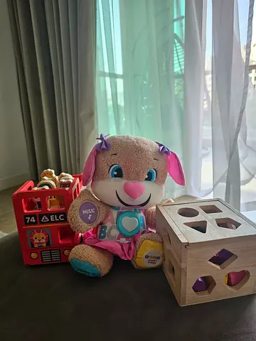 Montessori wooden shaps box, the London bus and Teddy.