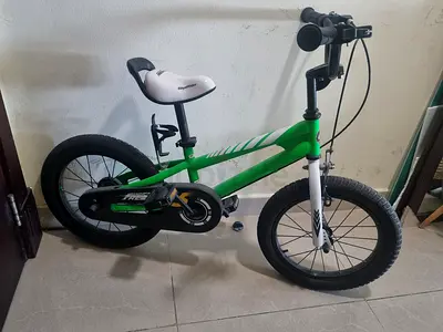 Green 16-inch Kids Bicycle - Good Condition with detachable guidewheels