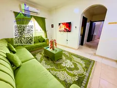 Fully furnished 2-bedroom apartment with 2 bathrooms and balcony, in a vibrant Al Mowaihat 3 locatio