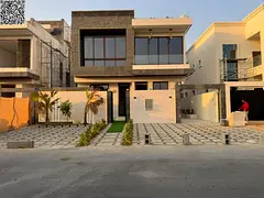 Luxury 6-bedroom villa with a rooftop terrace for sale in Al Helio 1, Ajman – Registration and own