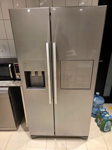 Large stainless steel side-by-side refrigerator with water dispenser