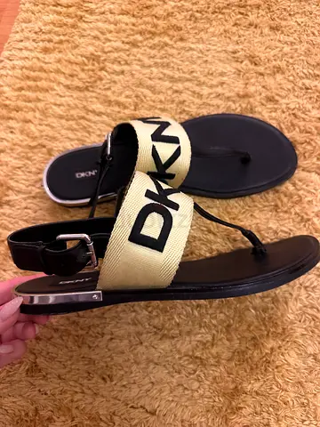 DKNY women's black thong sandals with beige branded strap - lightly used