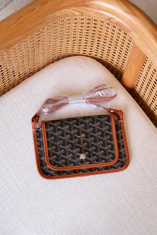 Small brown patterned crossbody bag with detachable strap