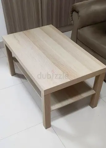 Light wood coffee table with lower shelf - good condition