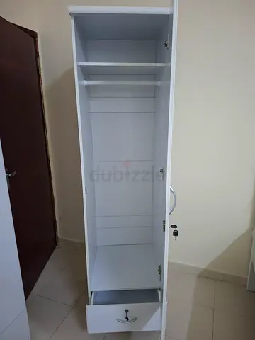 Tall white wardrobe/cabinet with drawers — good condition