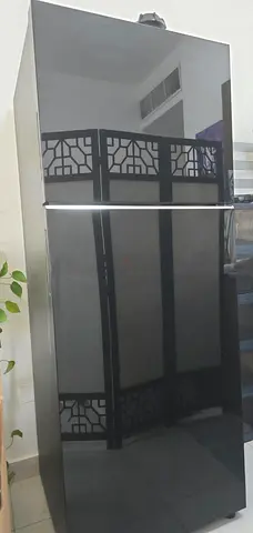 SAMSUNG Black two-door refrigerator in perfect condition, selling bcs i want to move to dubai