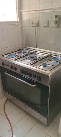 Stainless steel 5-burner gas cooker with oven - good working condition