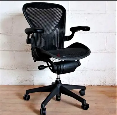 Herman Miller Comfortable black ergonomic mesh office chair (adjustable, swivel, wheels)
