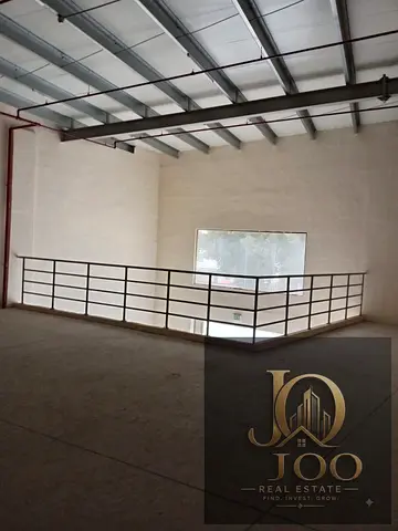 Warehouse in Al Jurf Industrial Area with a total area of 4,400 sq. ft., including a mezzanine, and equipped with a 25 kW electricity supply.