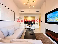 Sleek Furnished | Bright Unit | Airy Living Room