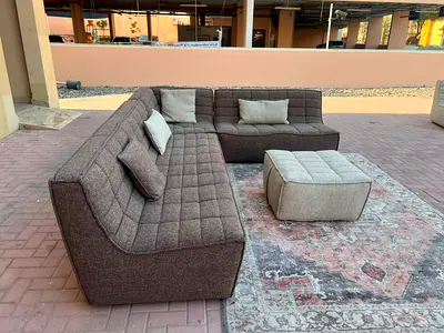 Available luxury Al Huzaifa Corner sofa and foostool like a new