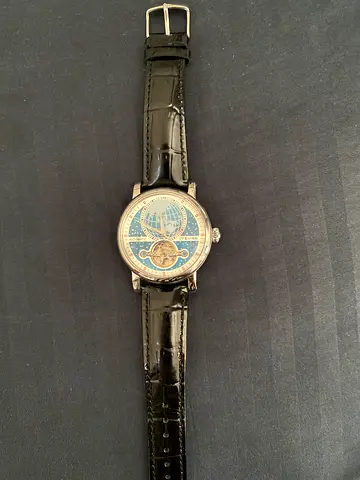 Men's mechanical wristwatch with black leather strap and moonphase dial