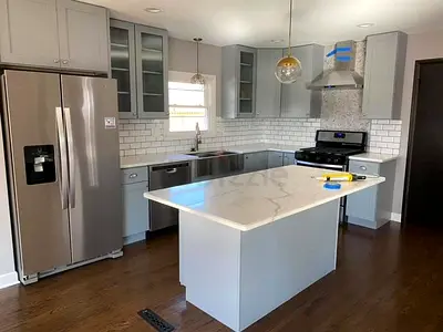 Modern grey kitchen island with marble top
