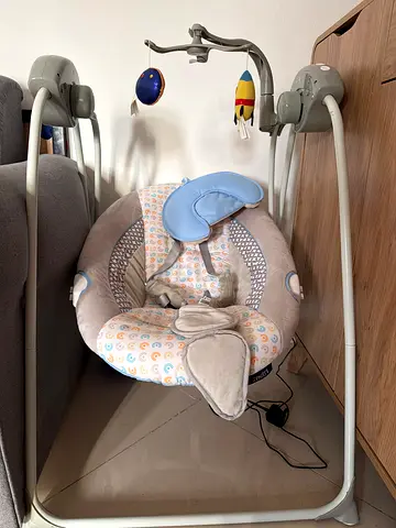 electric baby swing with toys - good condition