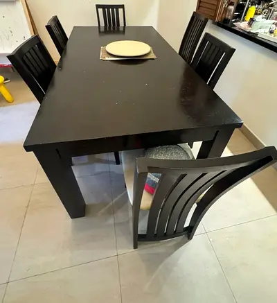 Solid dark wood 6-seater dining table with chairs