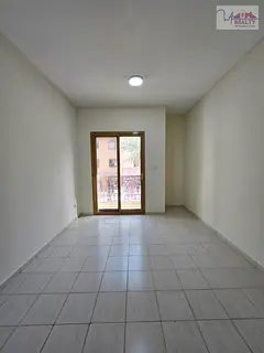1BR Apartment | EMR-03 International City | Balcony & Road View
