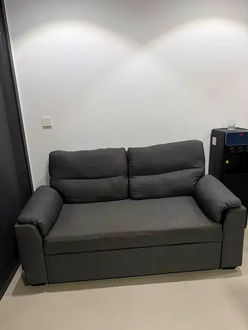 Compact 2-seater grey fabric sofa in good condition