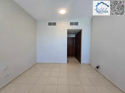 Two-bedroom apartment with a living room and a closed kitchen for rent in Ajman One Towers.