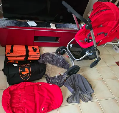 Red travel system stroller with parmback and accessories - good condition