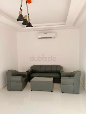 Grey 3-seater sofa with two armchairs and coffee table