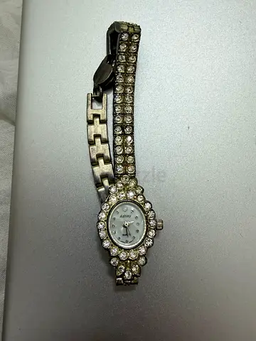 Ladies silver quartz watch with crystal-studded bracelet