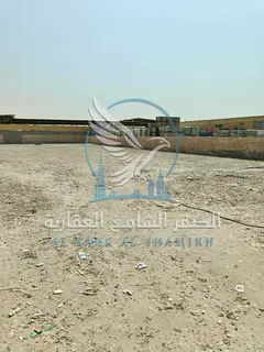 20,000 Sq. Ft. Yard for Rent in Al Sajaa | Offices & Bathrooms | Spacious Area | Prime Industrial Lo