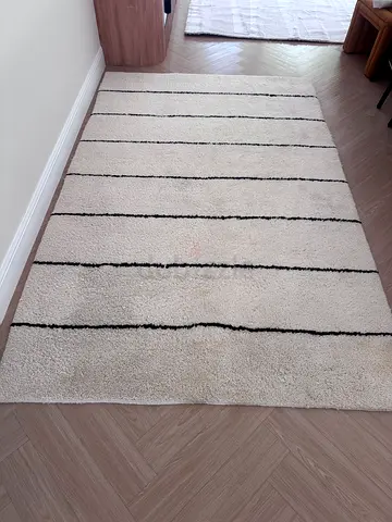 CB2 handknotted rug with black stripe detail - great condition