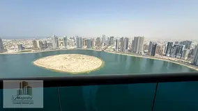 🏡 **For Sale: Unique Apartment with Direct Front View of Al Mamzar Lake – Sharjah** ✨ **Prime
