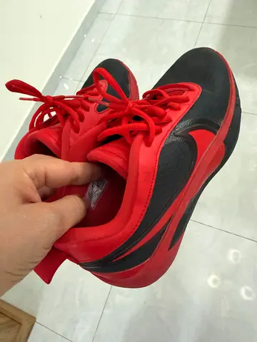 Red and black older child athletic sneakers, lightly used