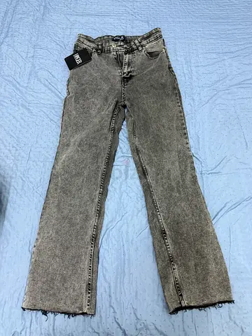 Grey acid-wash high-waist straight jeans, size tag visible (new)