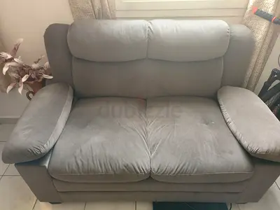 Comfortable 2-seater grey fabric sofa - good condition