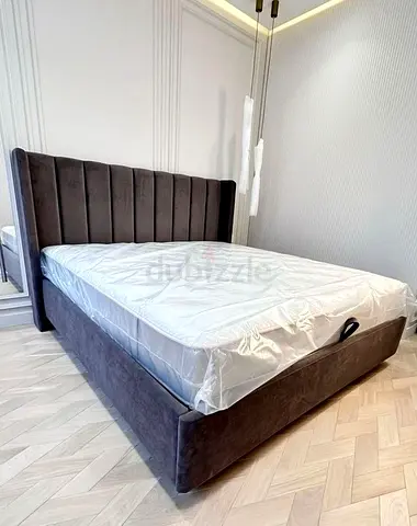 Modern upholstered king-size bed with padded headboard